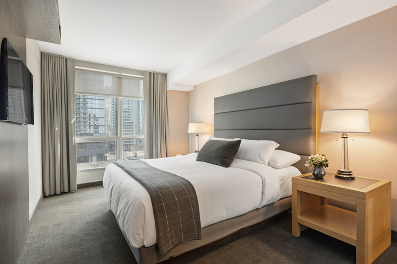 Blackout blinds Vancouver bedroom — dark roller blackout blinds for condo bedroom privacy and sleep